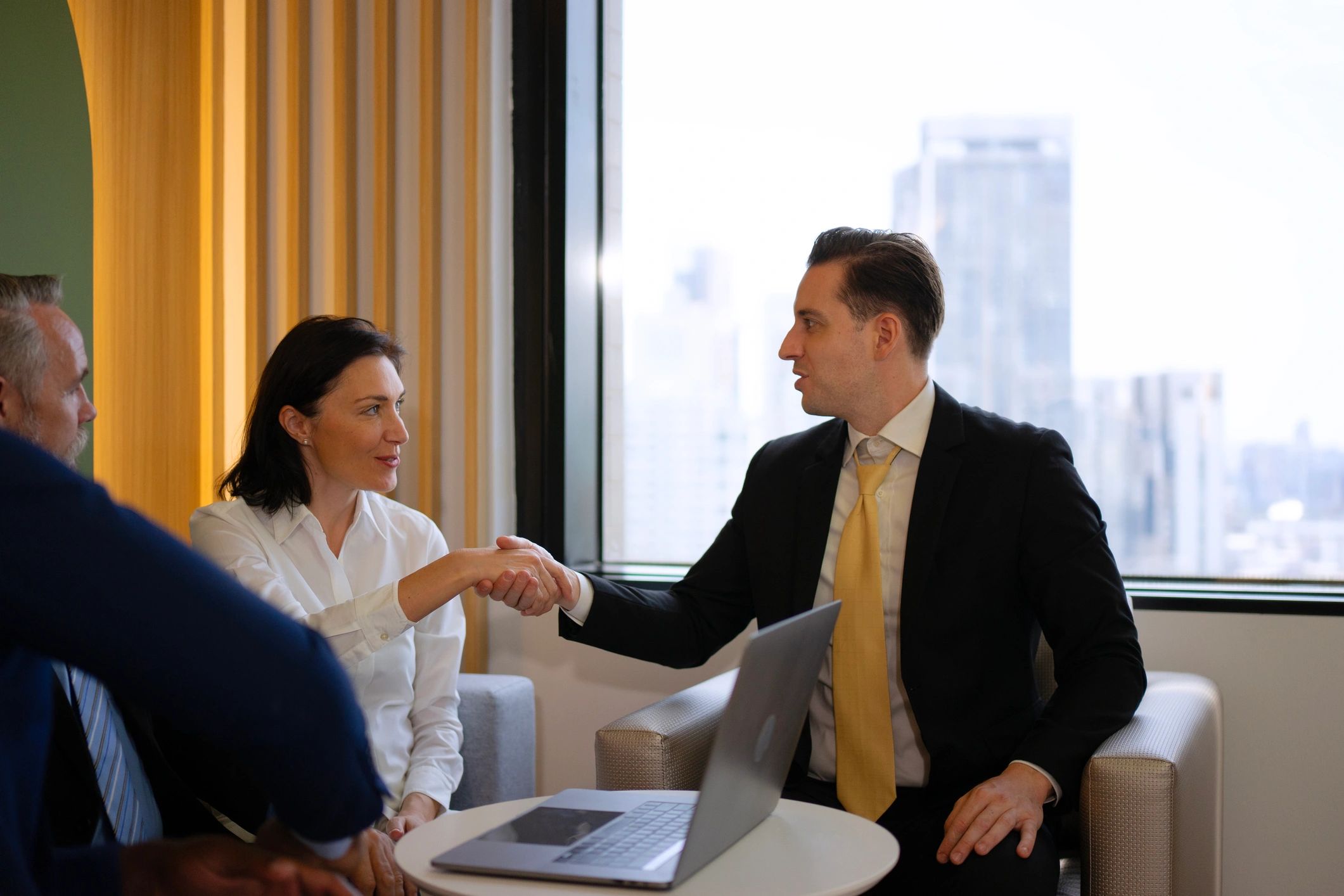 Accounting firm professionals collaborating in an office meeting