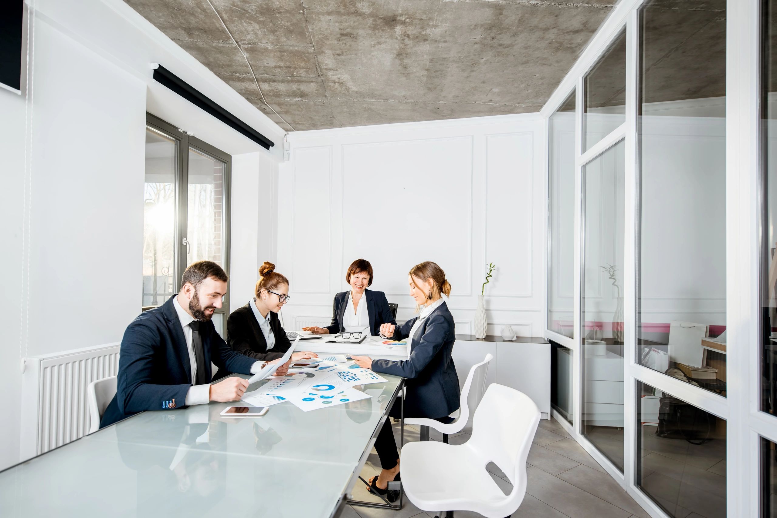 Business professionals collaborating around a conference table